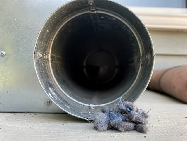 Baldwin Park Dryer Vent Cleaning technician using specialized equipment to clear severe dryer vent blockage in Baldwin Park